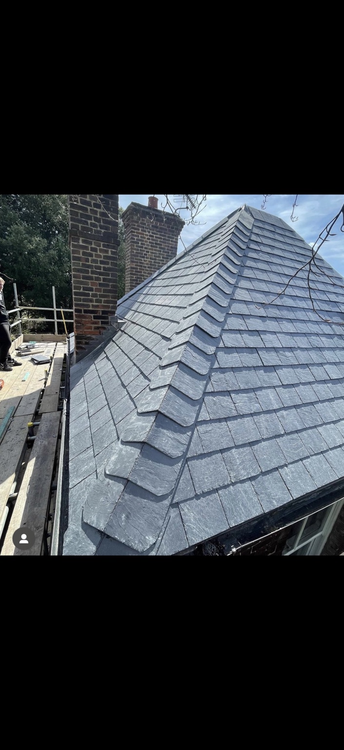 Slate roof with mitred hips