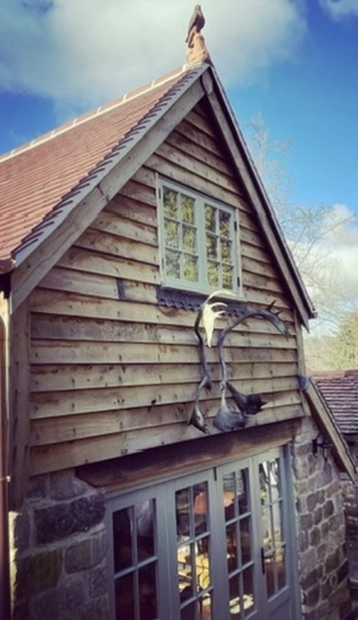 Maidstone_Roofer branded workwear on a slate roof